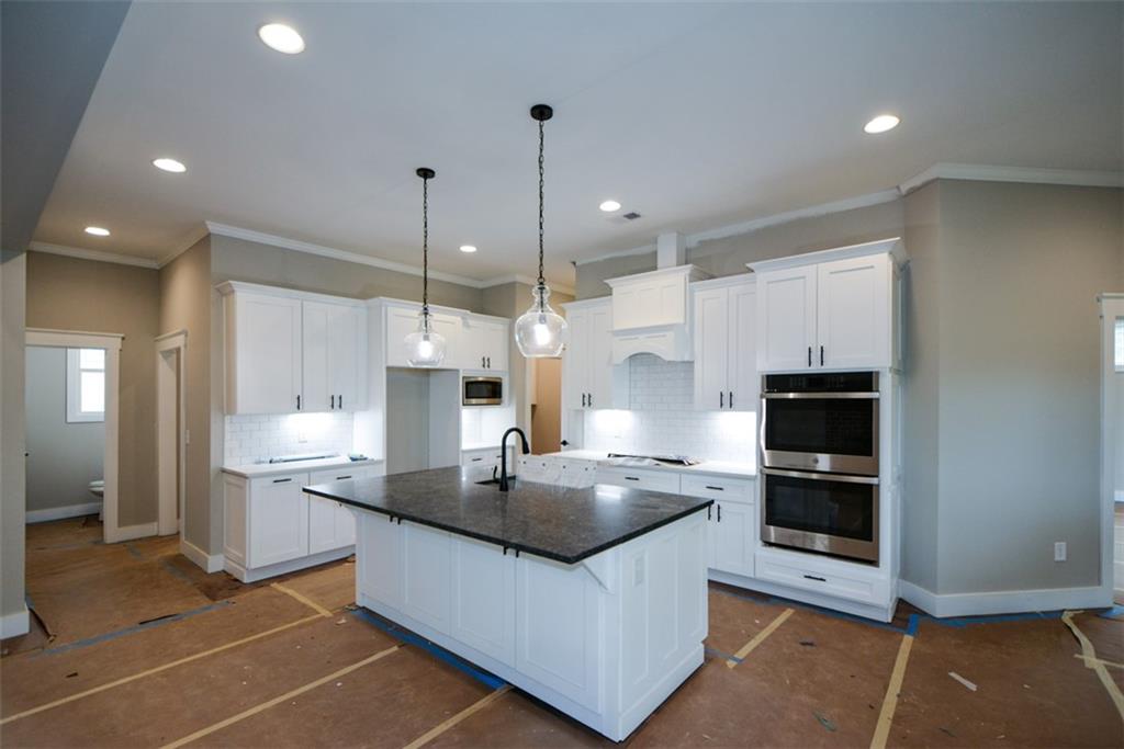 171 Field Stone Circle Jasper, GA 30143 - Photo 11 of 71 a kitchen with stainless steel appliances granite countertop a sink a stove and a refrigerator