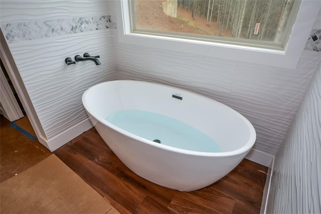 171 Field Stone Circle Jasper, GA 30143 - Photo 29 of 71 a white tub sitting next to a window