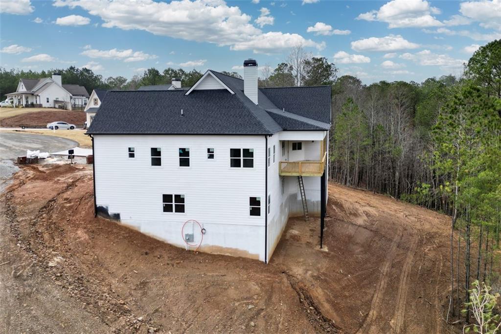171 Field Stone Circle Jasper, GA 30143 - Photo 65 of 71 a view of a white house with a big yard and large trees