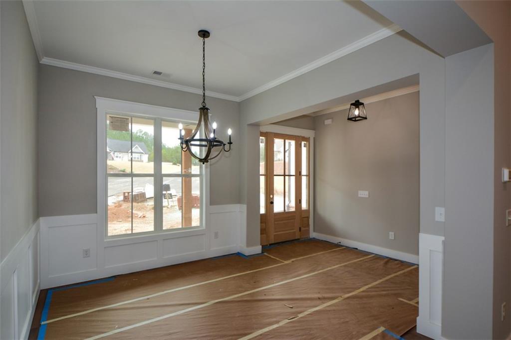 171 Field Stone Circle Jasper, GA 30143 - Photo 7 of 71 a view of an empty room with windows and chandelier