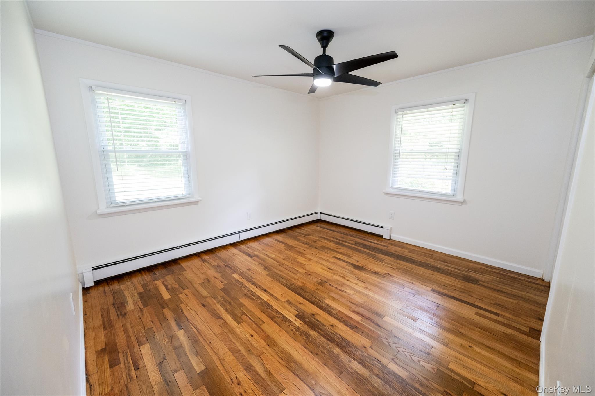 136 Foggintown Road Brewster, NY 10509 - Photo 29 of 50 a view of a big room with wooden floor and windows