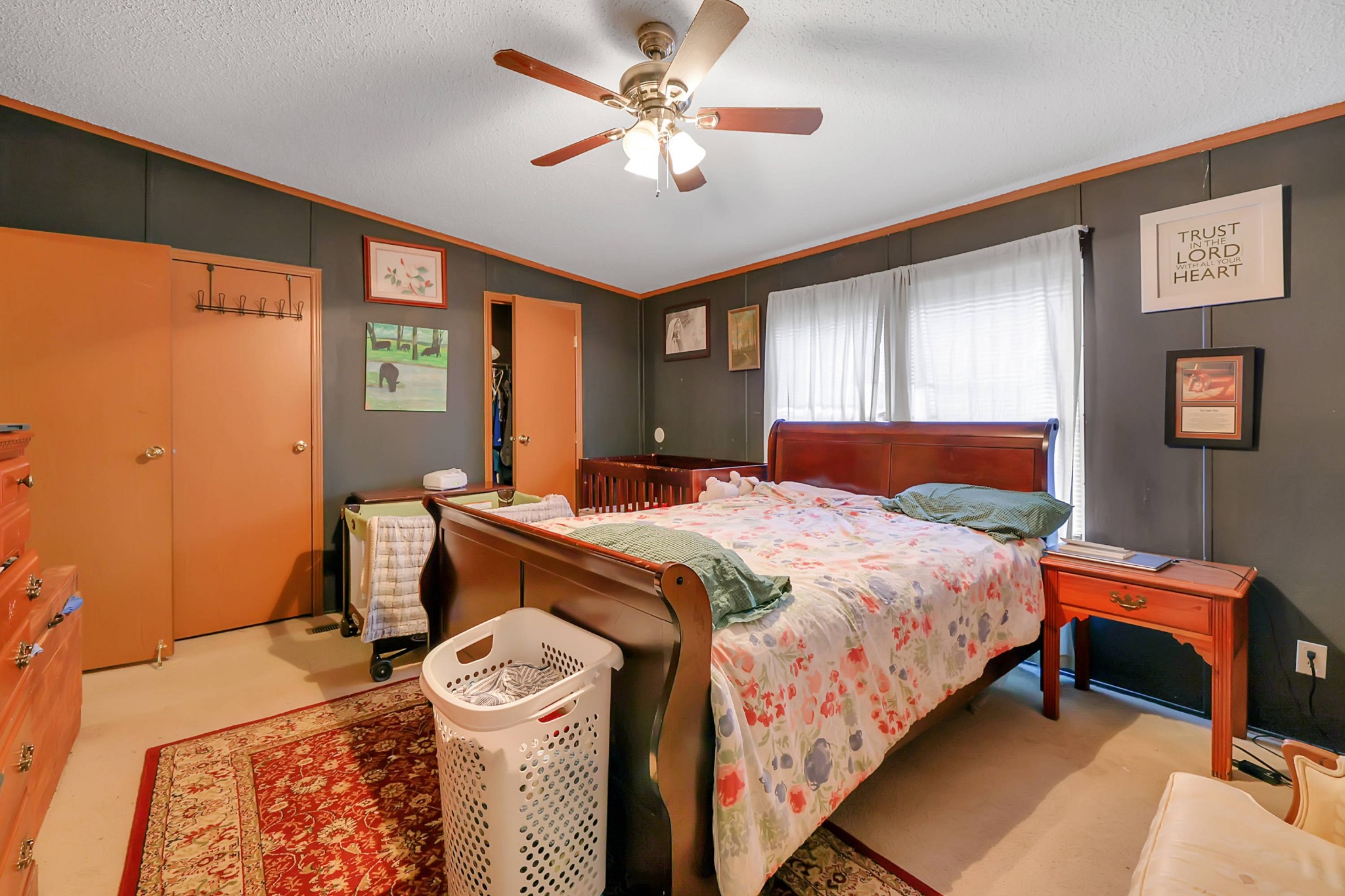 1241 Quarry Road Mount Juliet, TN 37122 - Photo 22 of 29 a bedroom with a bed and a chandelier