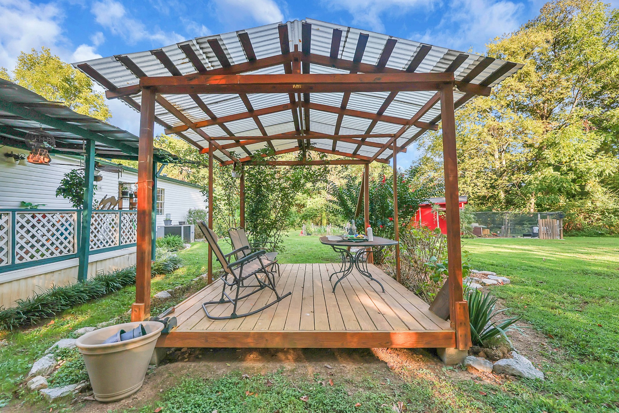 1241 Quarry Road Mount Juliet, TN 37122 - Photo 3 of 29 a view of a patio with a table and chairs potted plants