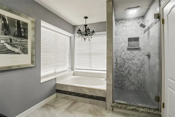 a bathroom with a shower and a sink