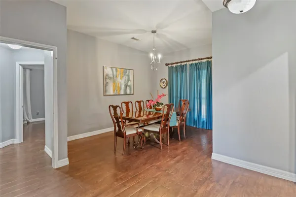 a dining room with furniture and window