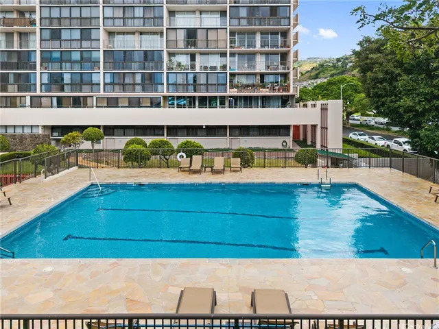a wooden bench sitting in front of a building