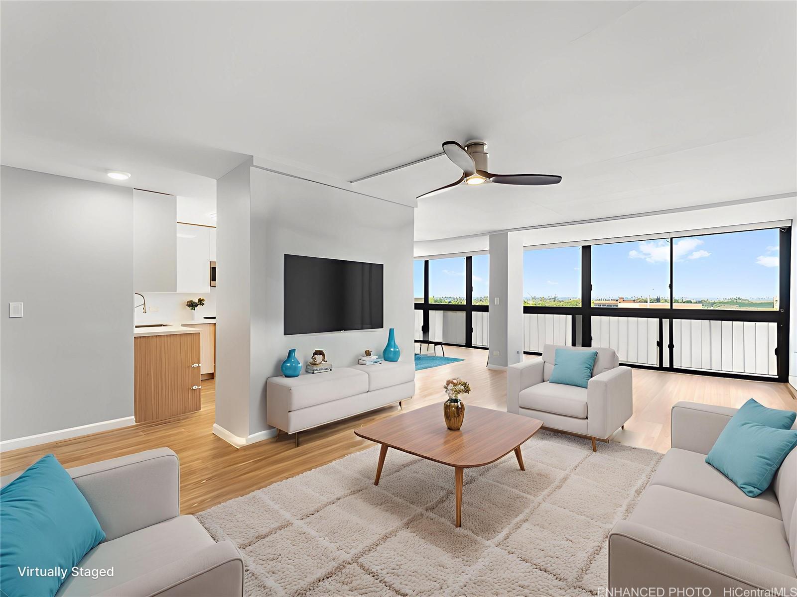 4300 Waialae Avenue, Unit B601 Honolulu, HI 96816 - Photo 3 of 18 a living room with furniture a flat screen tv and a large window