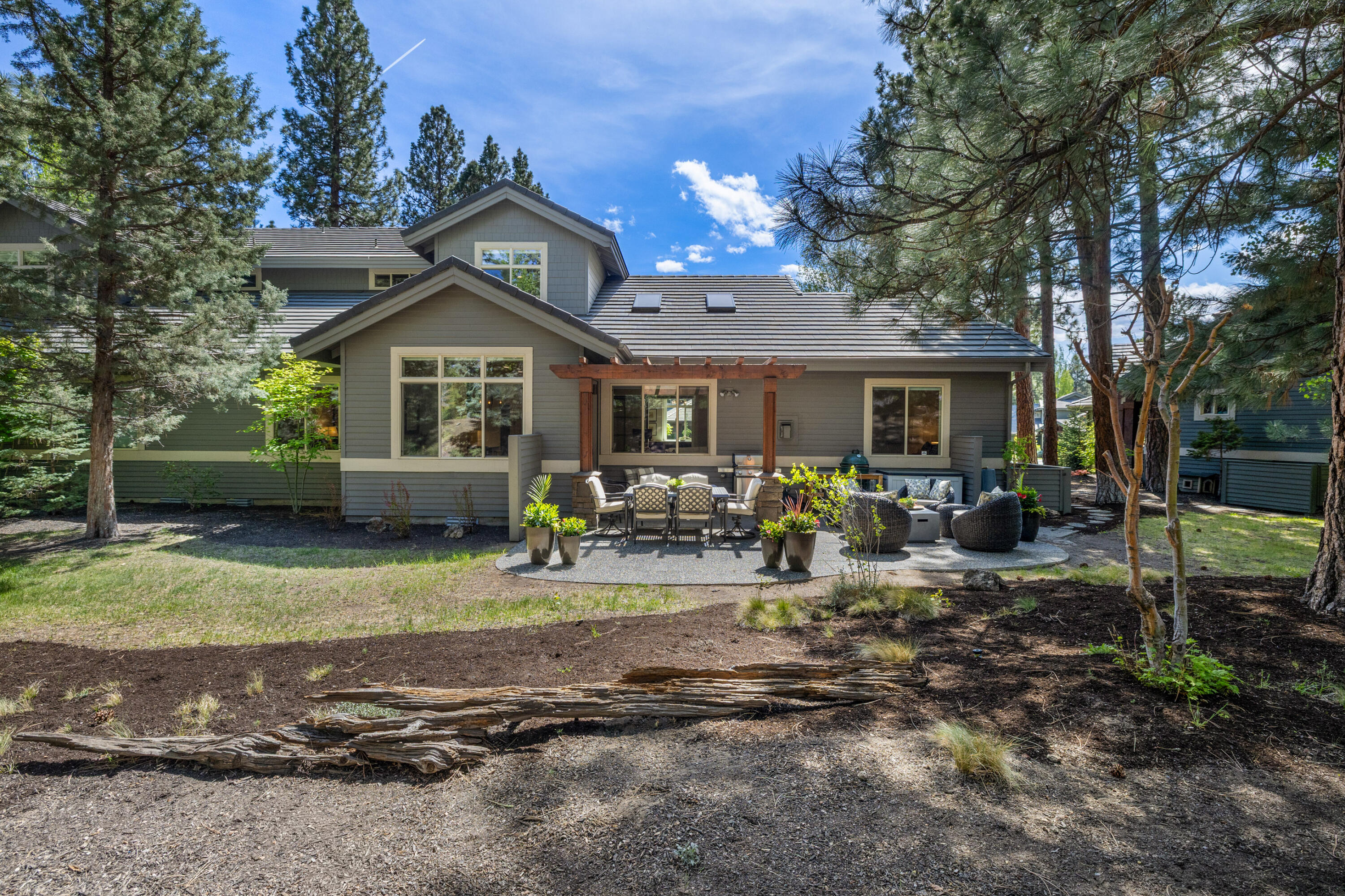 19460 Chip Shot Lane Bend, OR 97702 - Photo 46 of 56 a front view of a house with garden