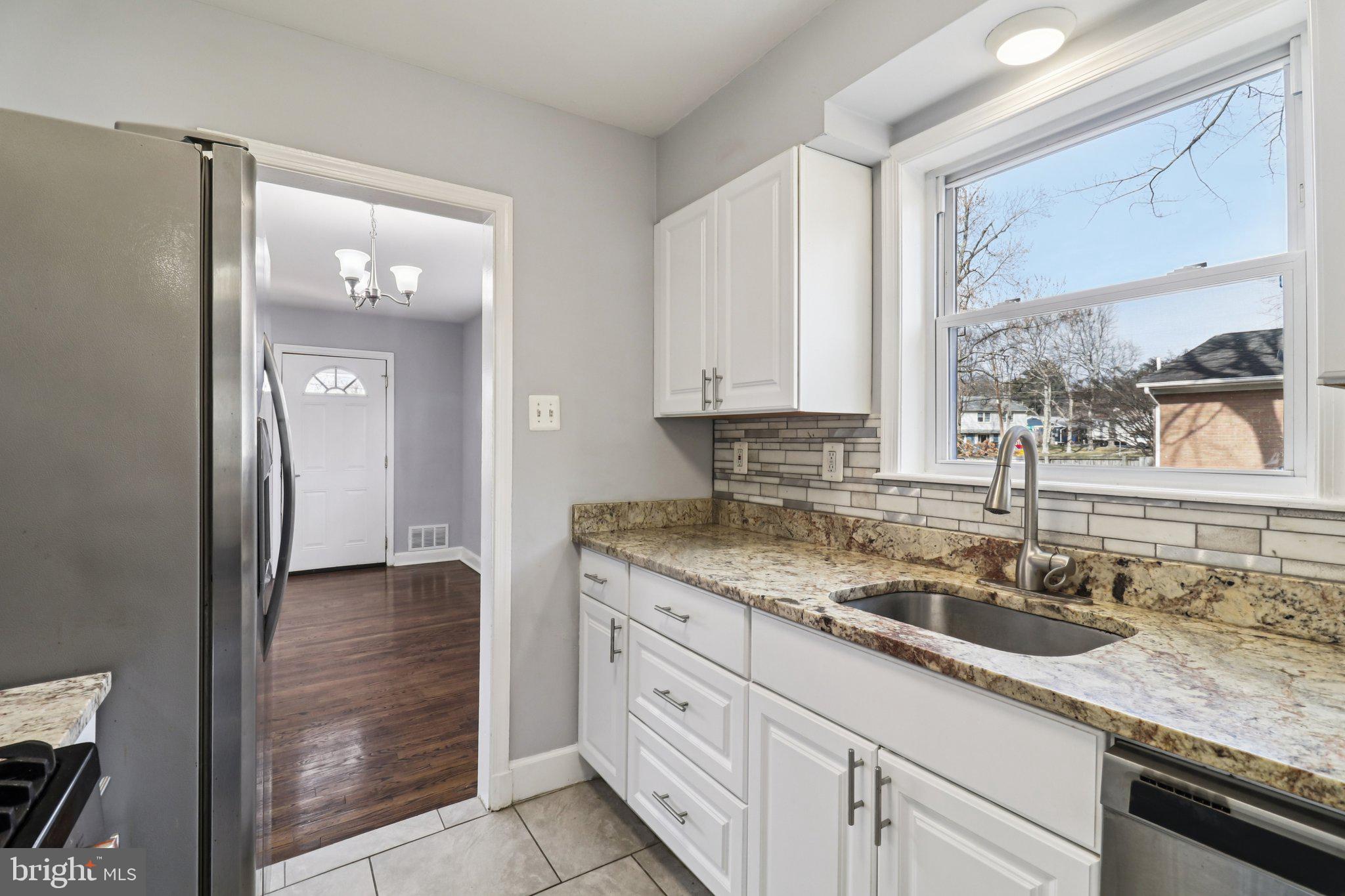 11515 Orebaugh Avenue Silver Spring, MD 20902 - Photo 16 of 69 a kitchen with a sink and cabinets