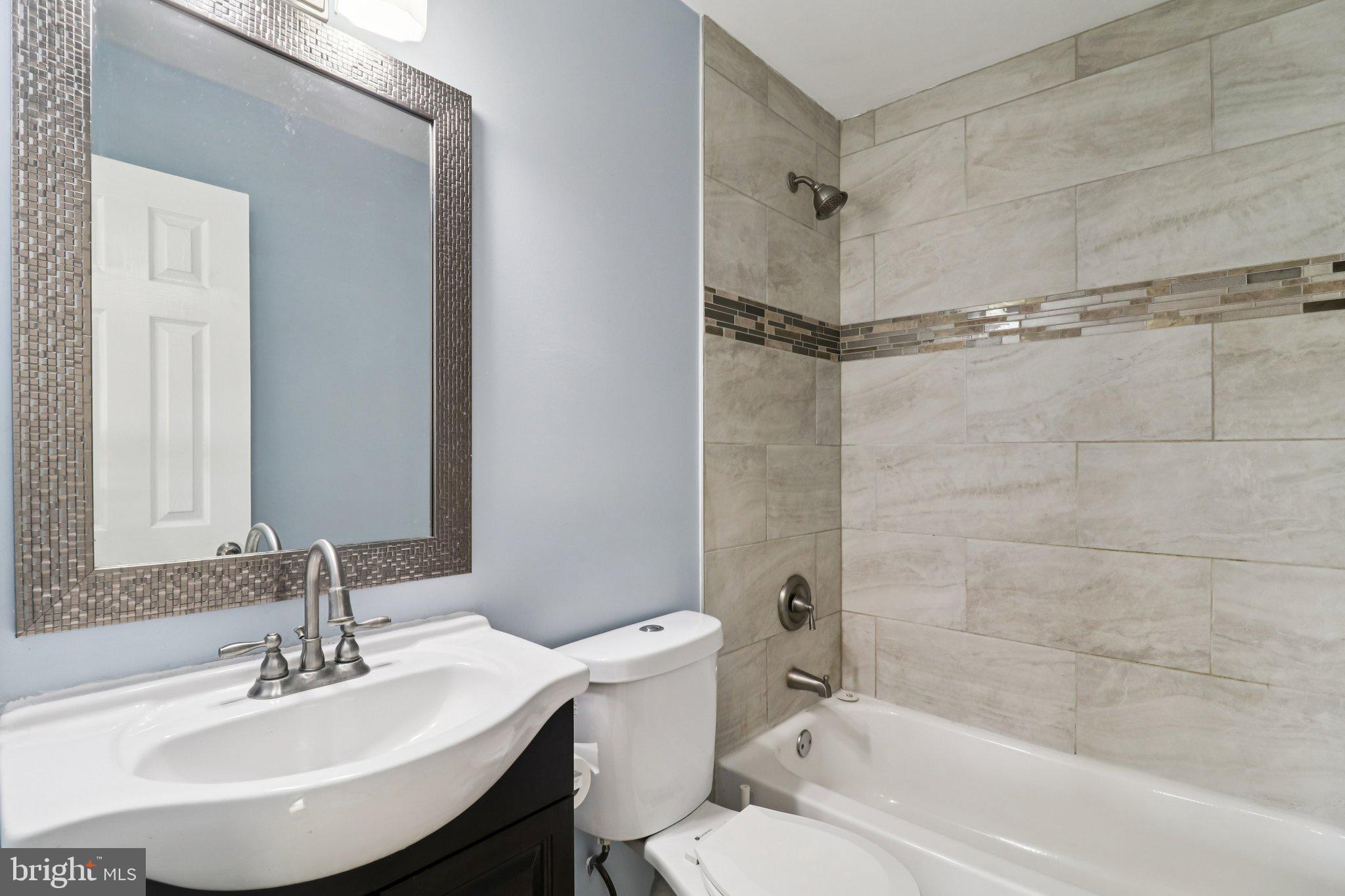 11515 Orebaugh Avenue Silver Spring, MD 20902 - Photo 19 of 69 a bathroom with a sink toilet and shower