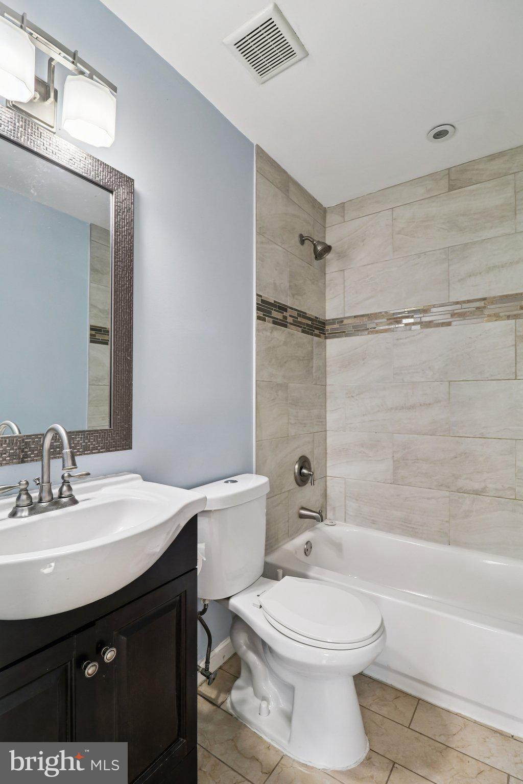 11515 Orebaugh Avenue Silver Spring, MD 20902 - Photo 21 of 69 a bathroom with a sink a toilet and a bathtub
