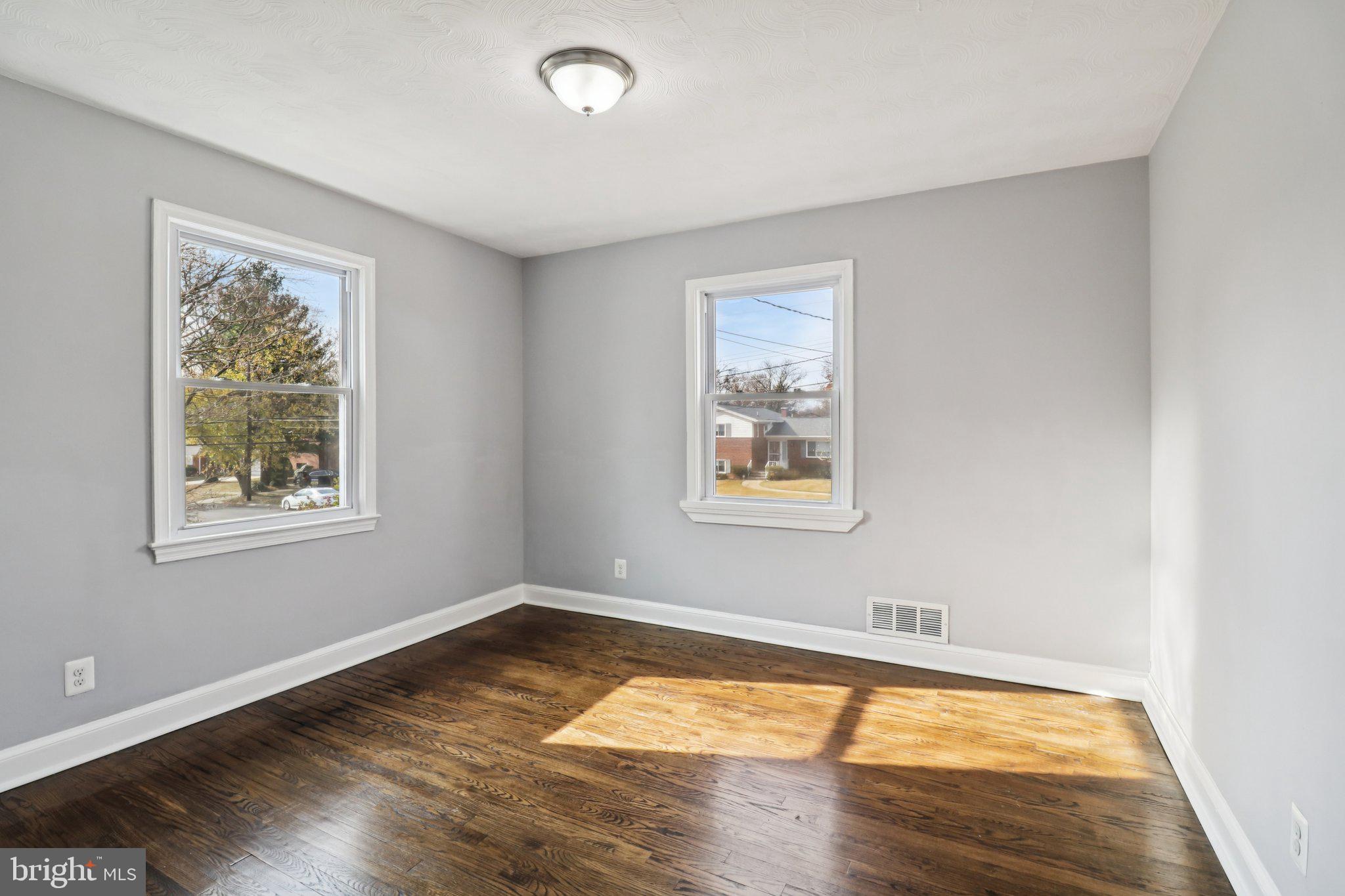 11515 Orebaugh Avenue Silver Spring, MD 20902 - Photo 22 of 69 a view of empty room with wooden floor and fan