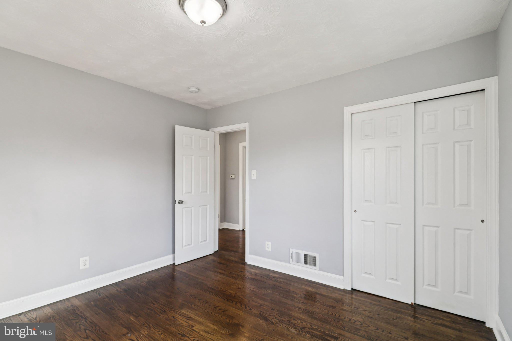 11515 Orebaugh Avenue Silver Spring, MD 20902 - Photo 24 of 69 a view of an empty room with wooden floor