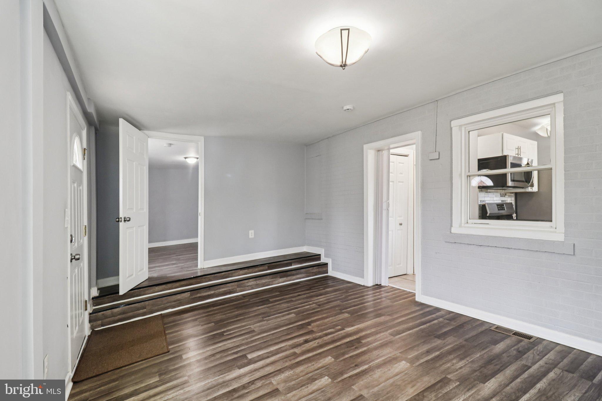 11515 Orebaugh Avenue Silver Spring, MD 20902 - Photo 25 of 69 a view of empty room with window and wooden floor