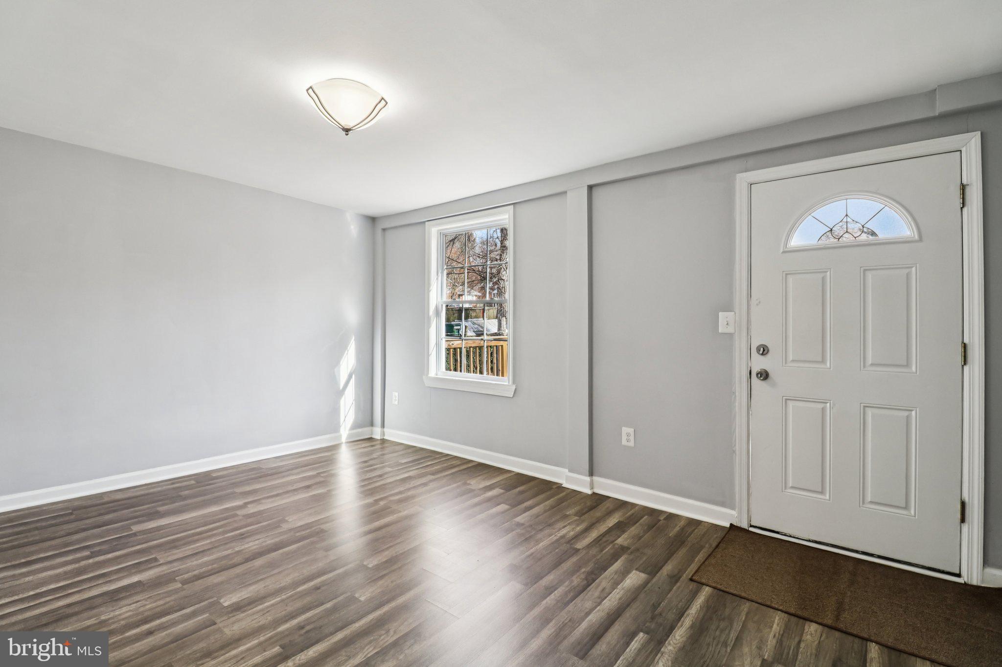 11515 Orebaugh Avenue Silver Spring, MD 20902 - Photo 26 of 69 a view of empty room with wooden floor and fan