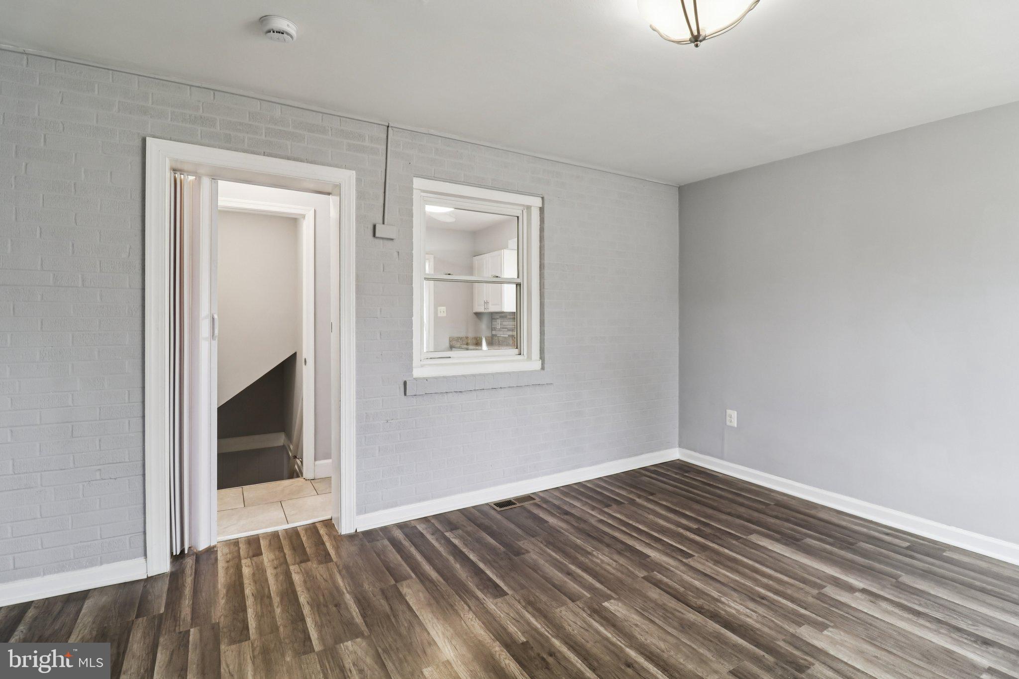 11515 Orebaugh Avenue Silver Spring, MD 20902 - Photo 28 of 69 a view of empty room with wooden floor and fan