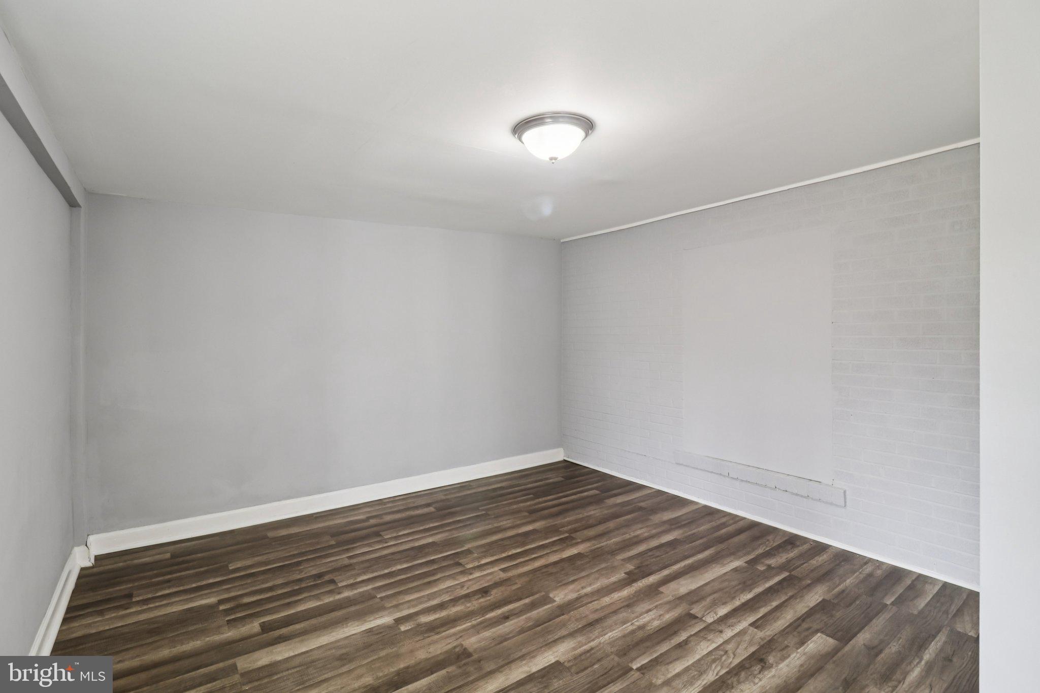 11515 Orebaugh Avenue Silver Spring, MD 20902 - Photo 29 of 69 a view of a room with wooden floor and white walls