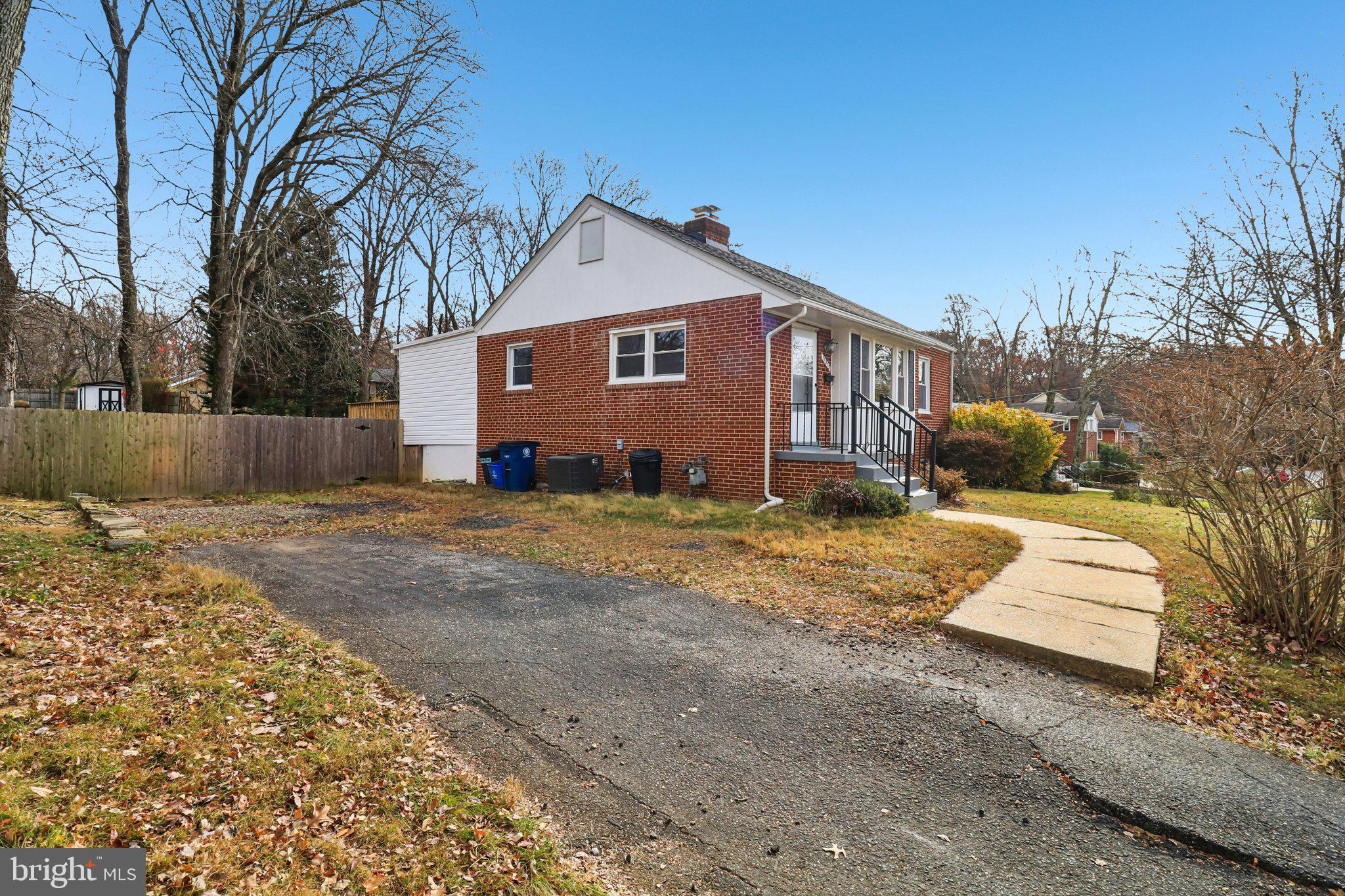 11515 Orebaugh Avenue Silver Spring, MD 20902 - Photo 3 of 69 a view of a house with a yard covered with snow in the background