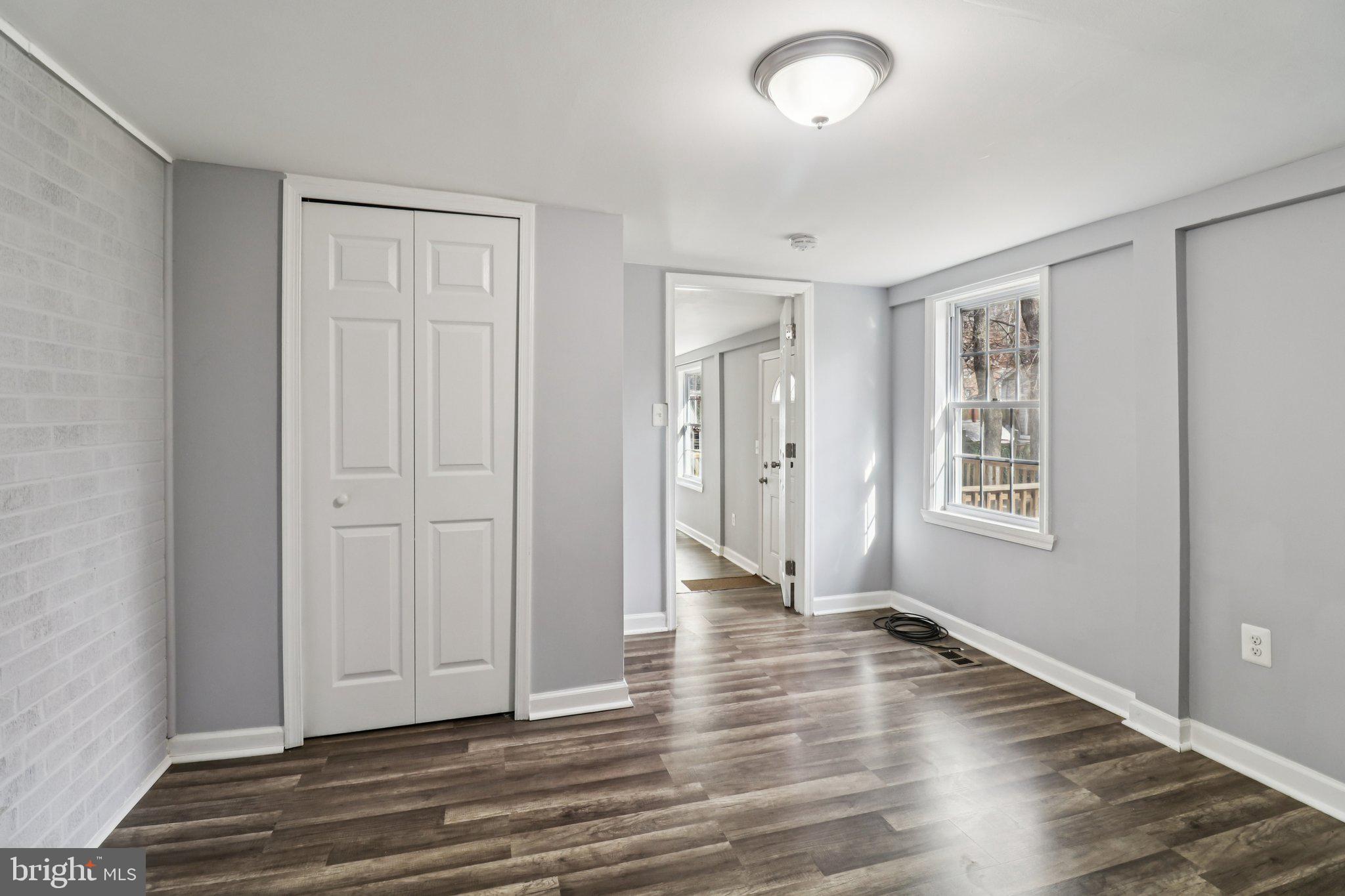 11515 Orebaugh Avenue Silver Spring, MD 20902 - Photo 31 of 69 an empty room with wooden floor and windows