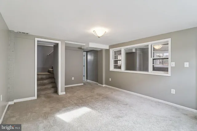 a view of an empty room with a window