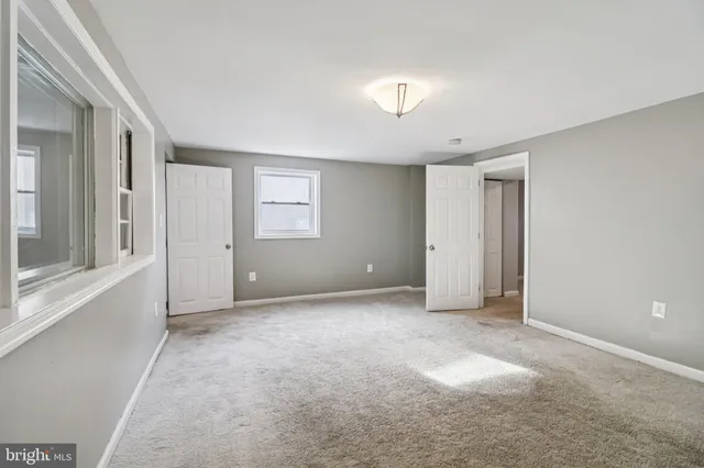 an empty room with a mirror