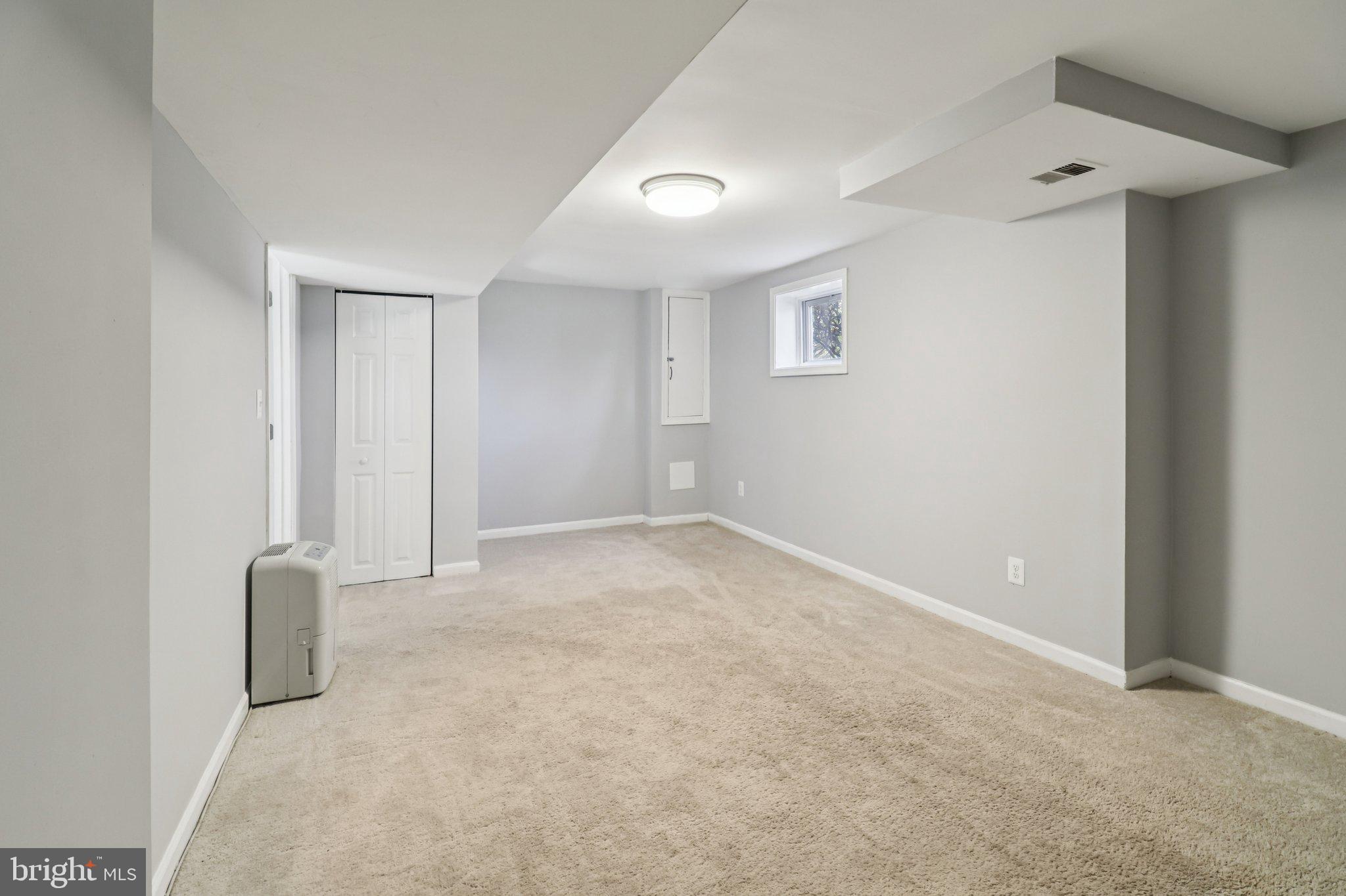 11515 Orebaugh Avenue Silver Spring, MD 20902 - Photo 38 of 69 an empty room with a natural light