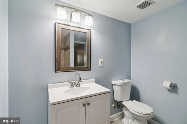 a bathroom with a shower and a glass door