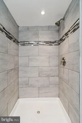 an empty room with a empty space and windows