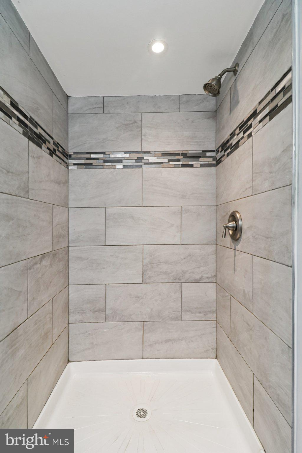 11515 Orebaugh Avenue Silver Spring, MD 20902 - Photo 43 of 69 a bathroom with a shower and a glass door