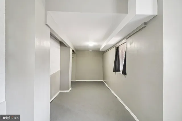 a view of deck with wooden floor and fence next to a yard