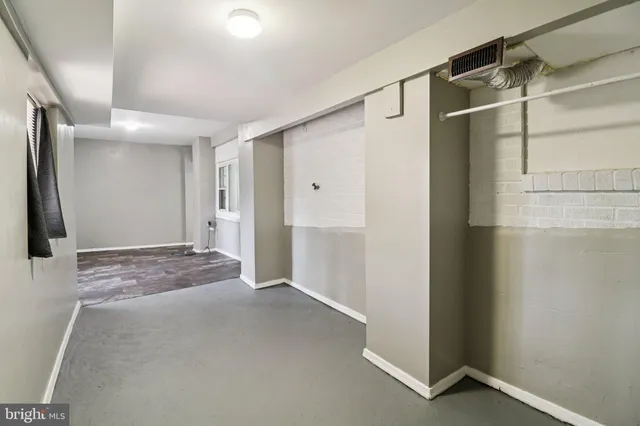 a view of a yard with yellow house