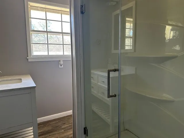 a bathroom with a sink and window