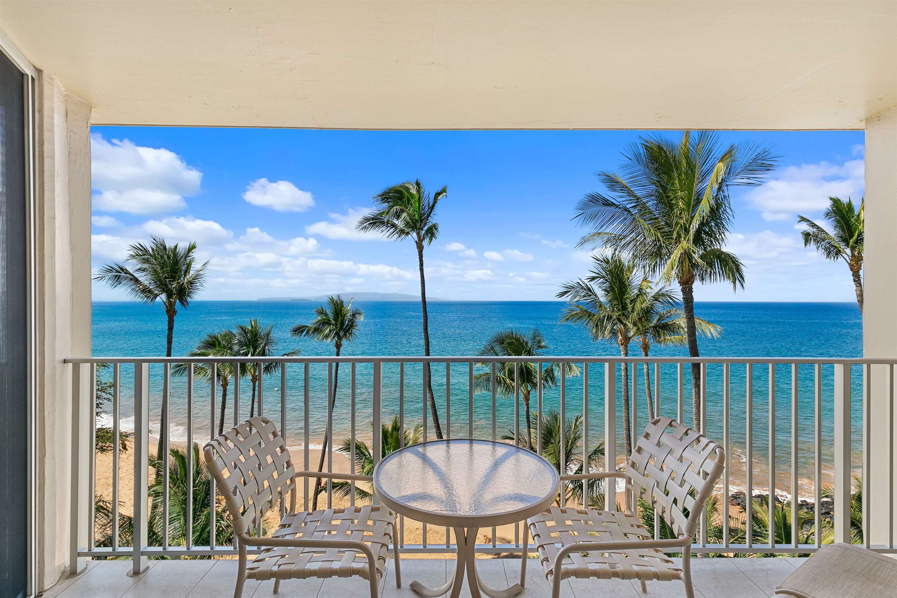 a view of a swimming pool with a table and chairs