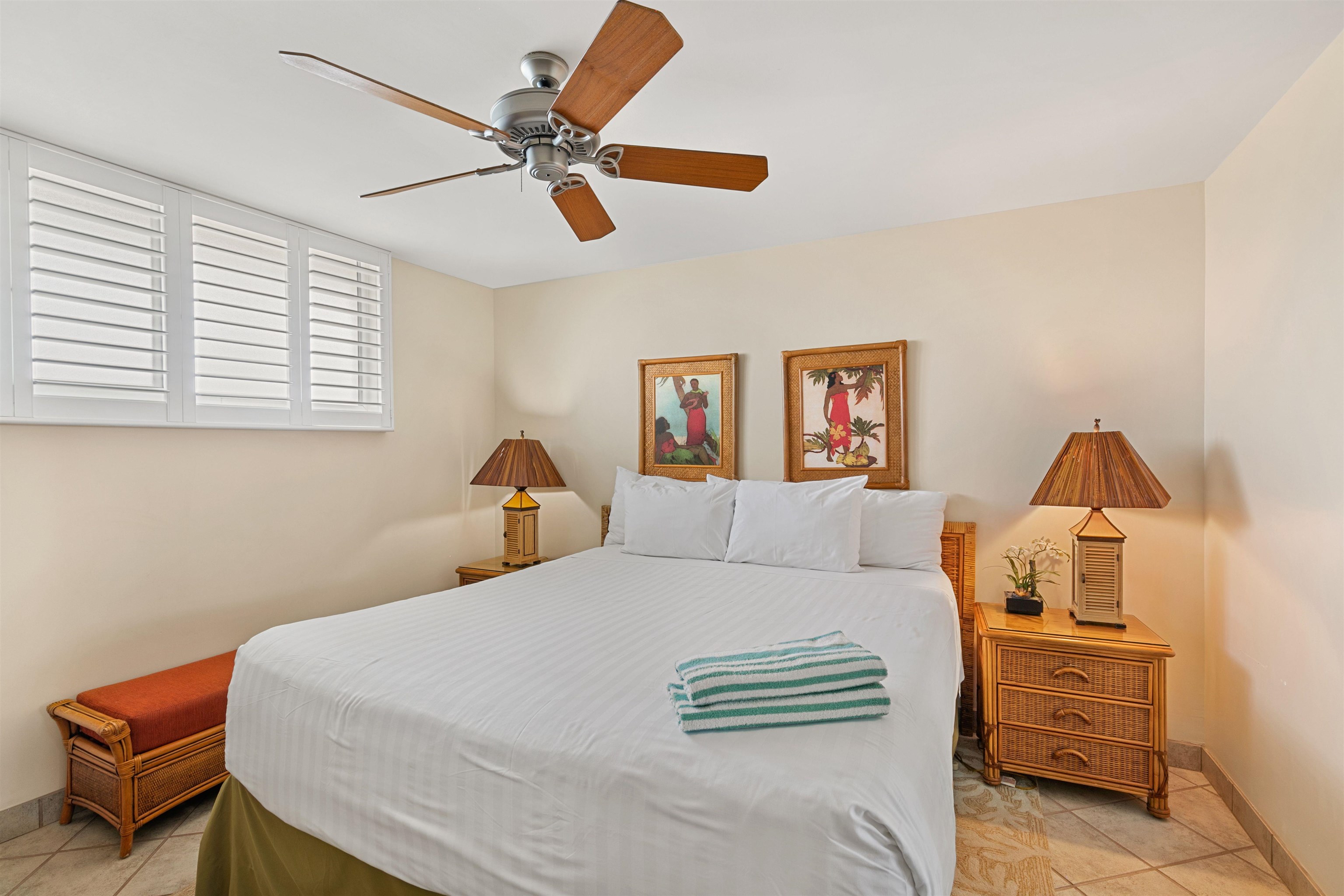 2480 South Kihei Road, Unit 702 Kihei, HI 96753 - Photo 11 of 24 a bedroom with a bed and a chandelier