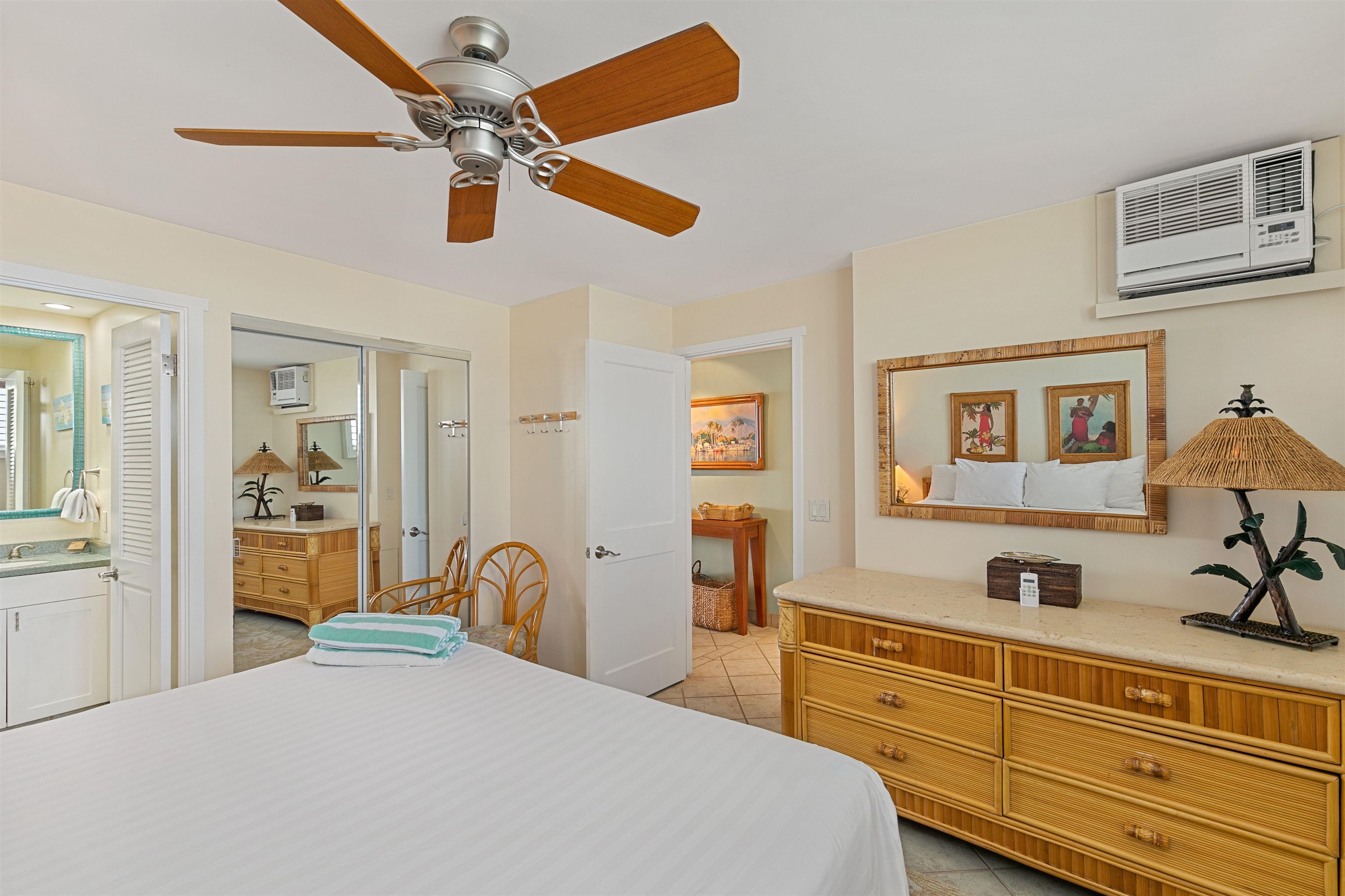 2480 South Kihei Road, Unit 702 Kihei, HI 96753 - Photo 12 of 24 a bedroom with a bed and a dresser