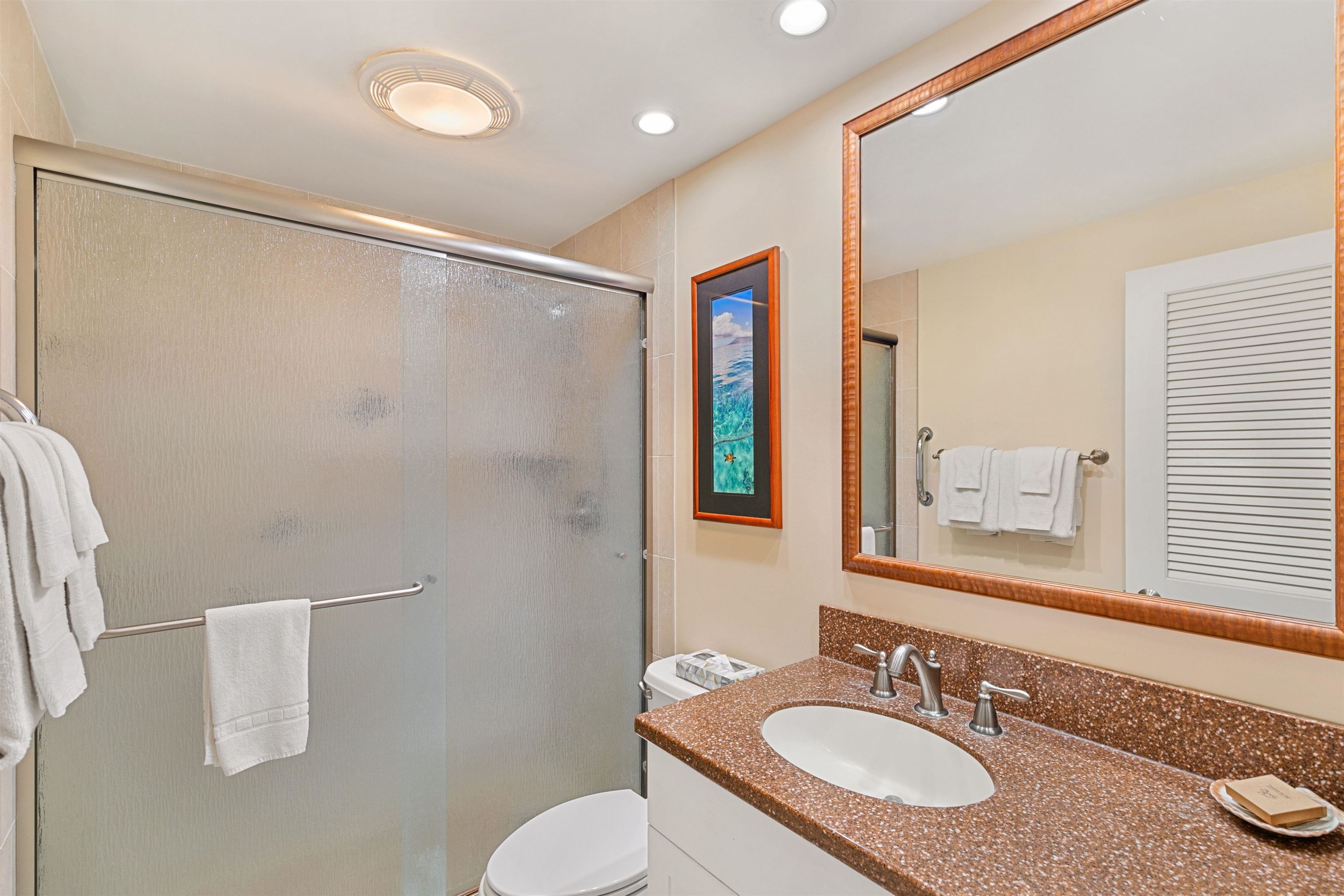 2480 South Kihei Road, Unit 702 Kihei, HI 96753 - Photo 16 of 24 a bathroom with a granite countertop sink and a mirror
