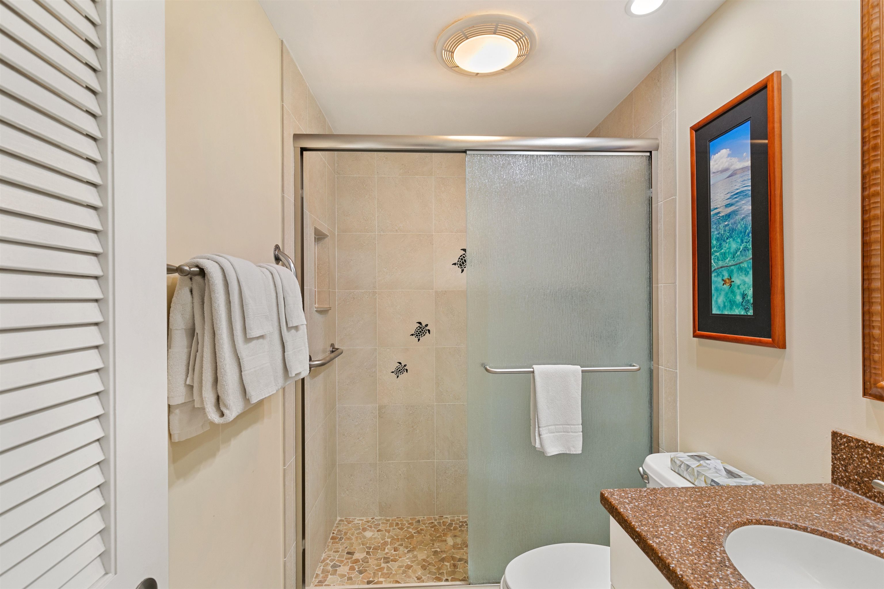 2480 South Kihei Road, Unit 702 Kihei, HI 96753 - Photo 17 of 24 a bathroom with a sink toilet and shower