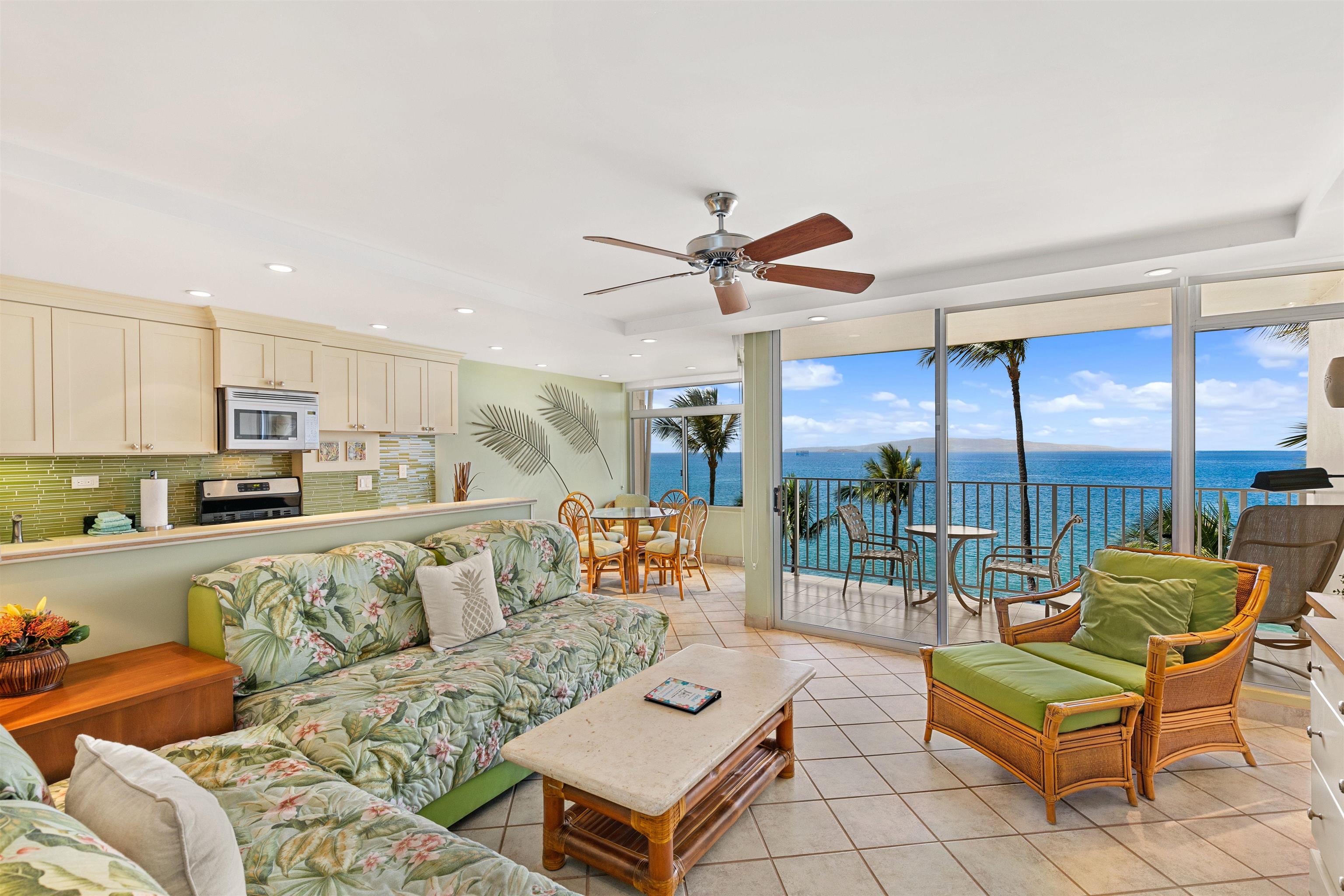 2480 South Kihei Road, Unit 702 Kihei, HI 96753 - Photo 2 of 24 a living room with furniture kitchen view and a large window