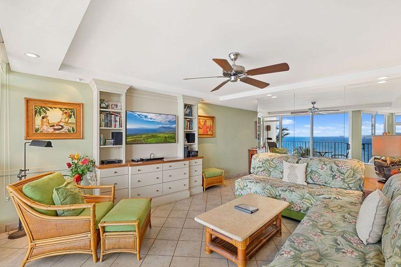 2480 South Kihei Road, Unit 702 Kihei, HI 96753 - Photo 4 of 24 a living room with furniture a ceiling fan and a window