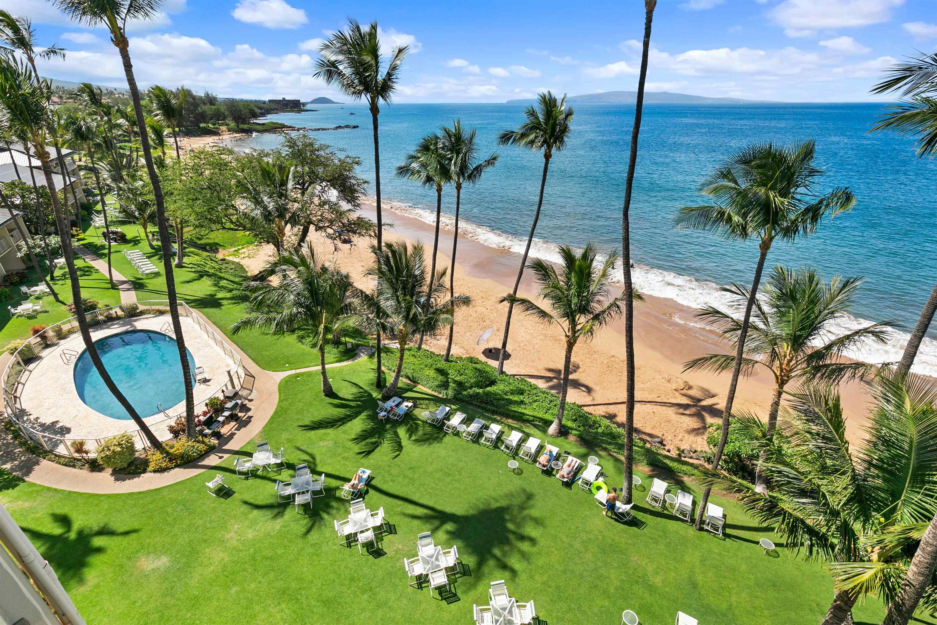 2480 South Kihei Road, Unit 702 Kihei, HI 96753 - Photo 5 of 24 a view of a swimming pool with a yard