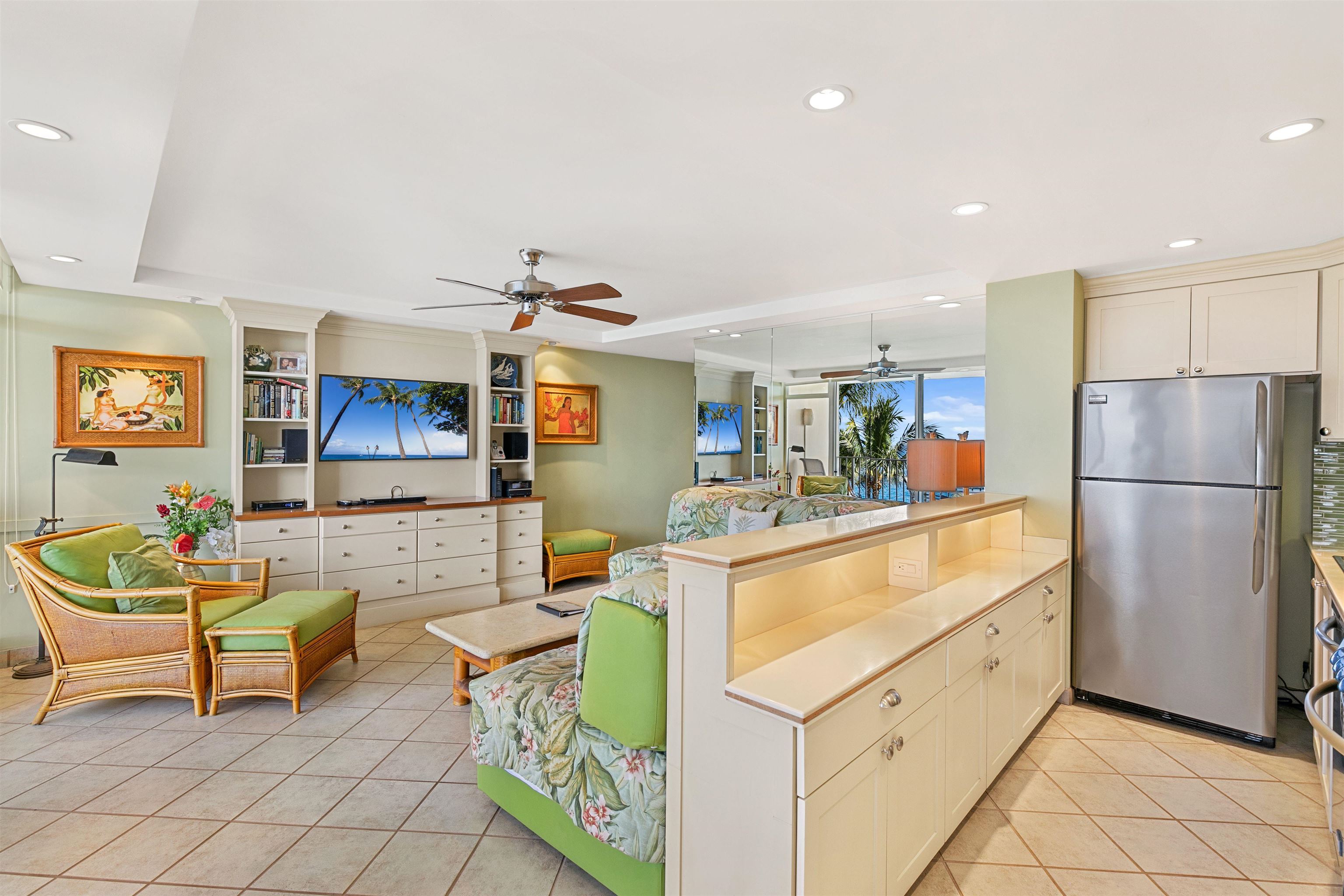 2480 South Kihei Road, Unit 702 Kihei, HI 96753 - Photo 9 of 24 a kitchen with stainless steel appliances granite countertop a refrigerator and a stove top oven