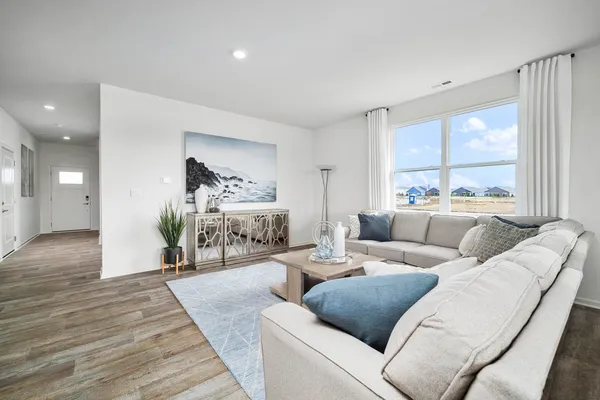 a living room with furniture and a large window