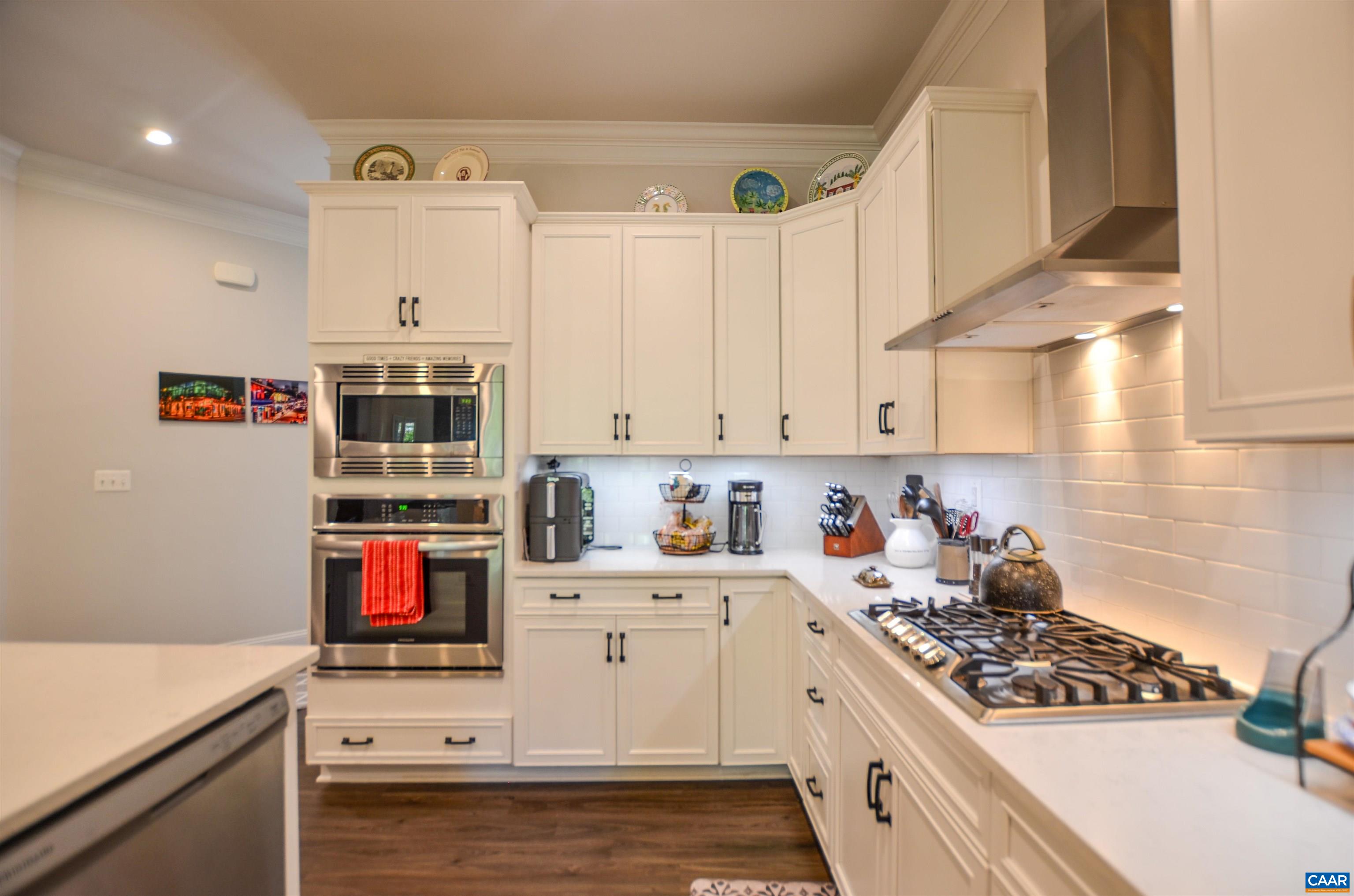 327 Claibourne Road Crozet, VA 22932 - Photo 10 of 36 a kitchen with stainless steel appliances a sink stove and cabinets