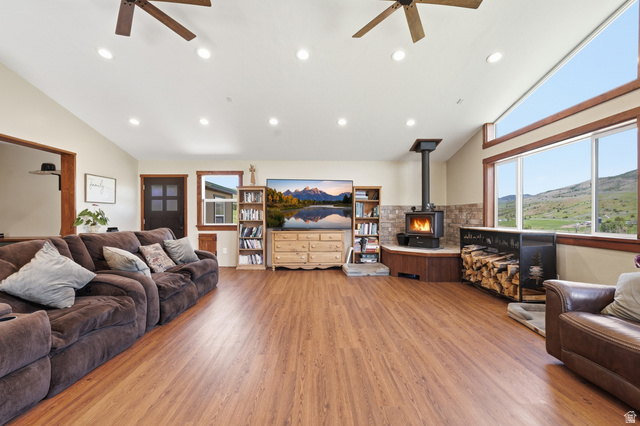 8066 North Valley View Heights Preston, ID 83263 - Photo 6 of 34 Expansive living area featuring wood-finish flooring, a vaulted ceiling with recessed lighting, and dual ceiling fans