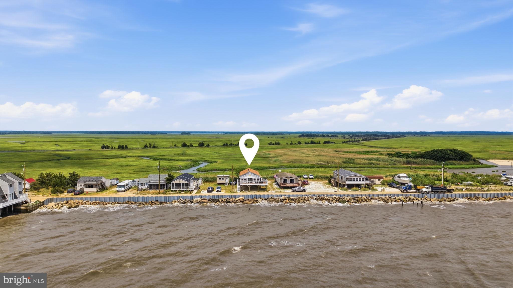 173 Cove Road Newport, NJ 08345 - Photo 54 of 72 a view of a large body of water with lots of green space