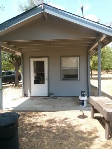 a backyard of a house with a yard and garage