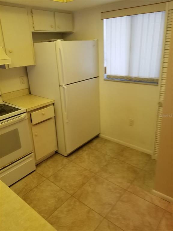 25225 Rampart Boulevard, Unit 2001 Punta Gorda, FL 33983 - Photo 4 of 7 a view of a refrigerator in a room