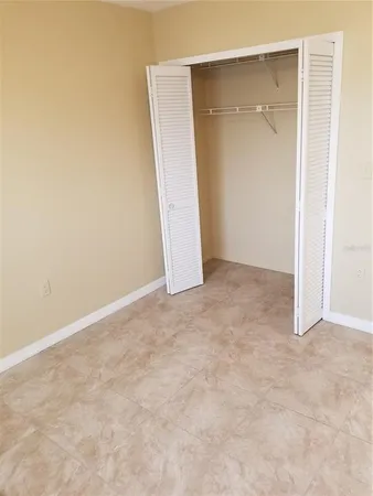 an empty room with an entryway door