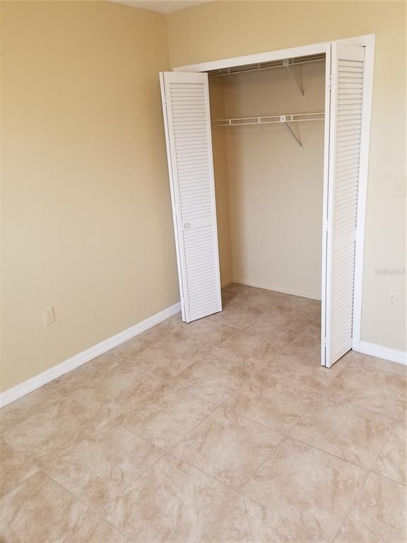 25225 Rampart Boulevard, Unit 2001 Punta Gorda, FL 33983 - Photo 5 of 7 an empty room with an entryway door