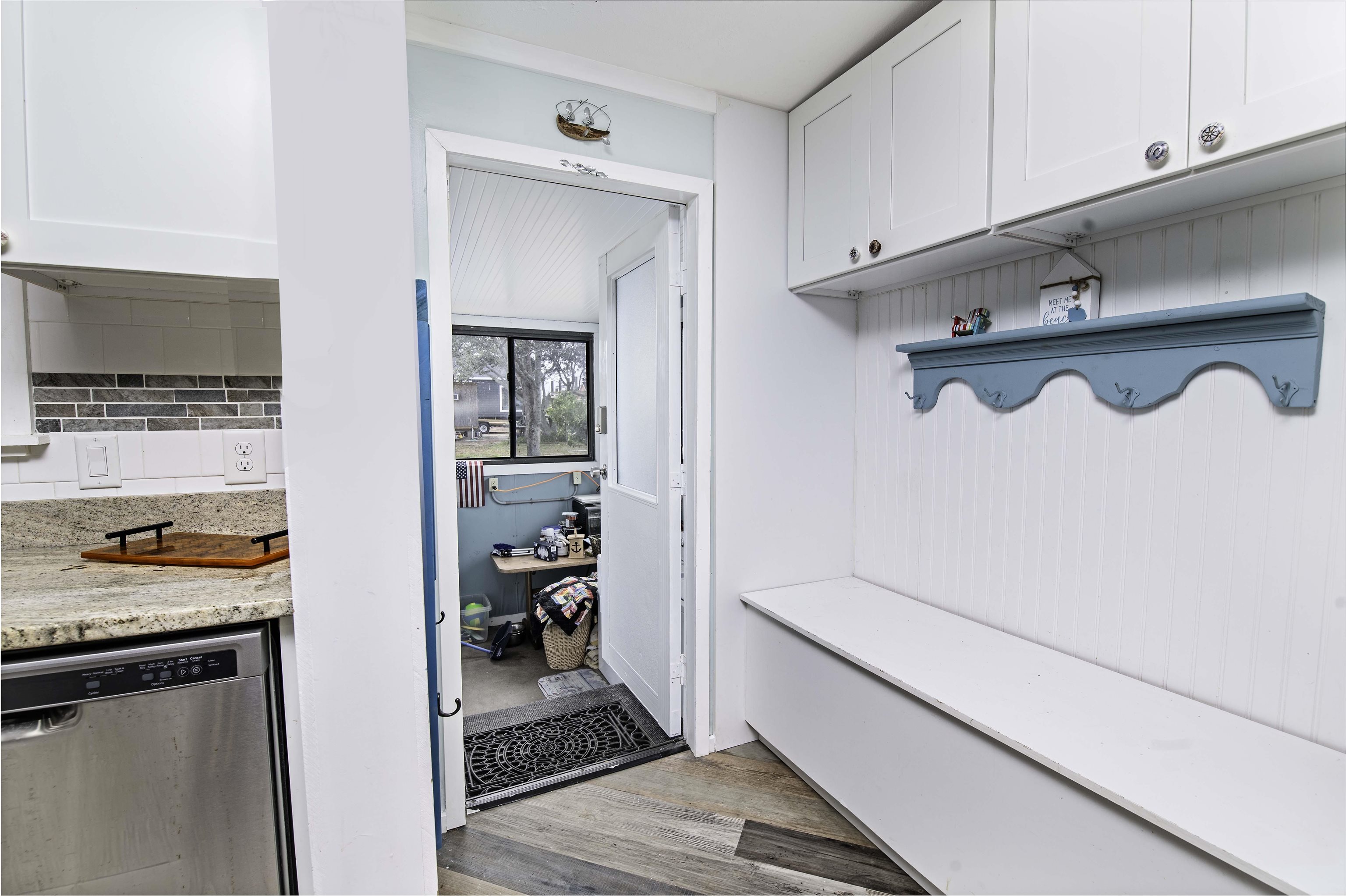 266 Pizarro Road St. Augustine, FL 32080 - Photo 11 of 26 a hallway with cabinets and wooden floor
